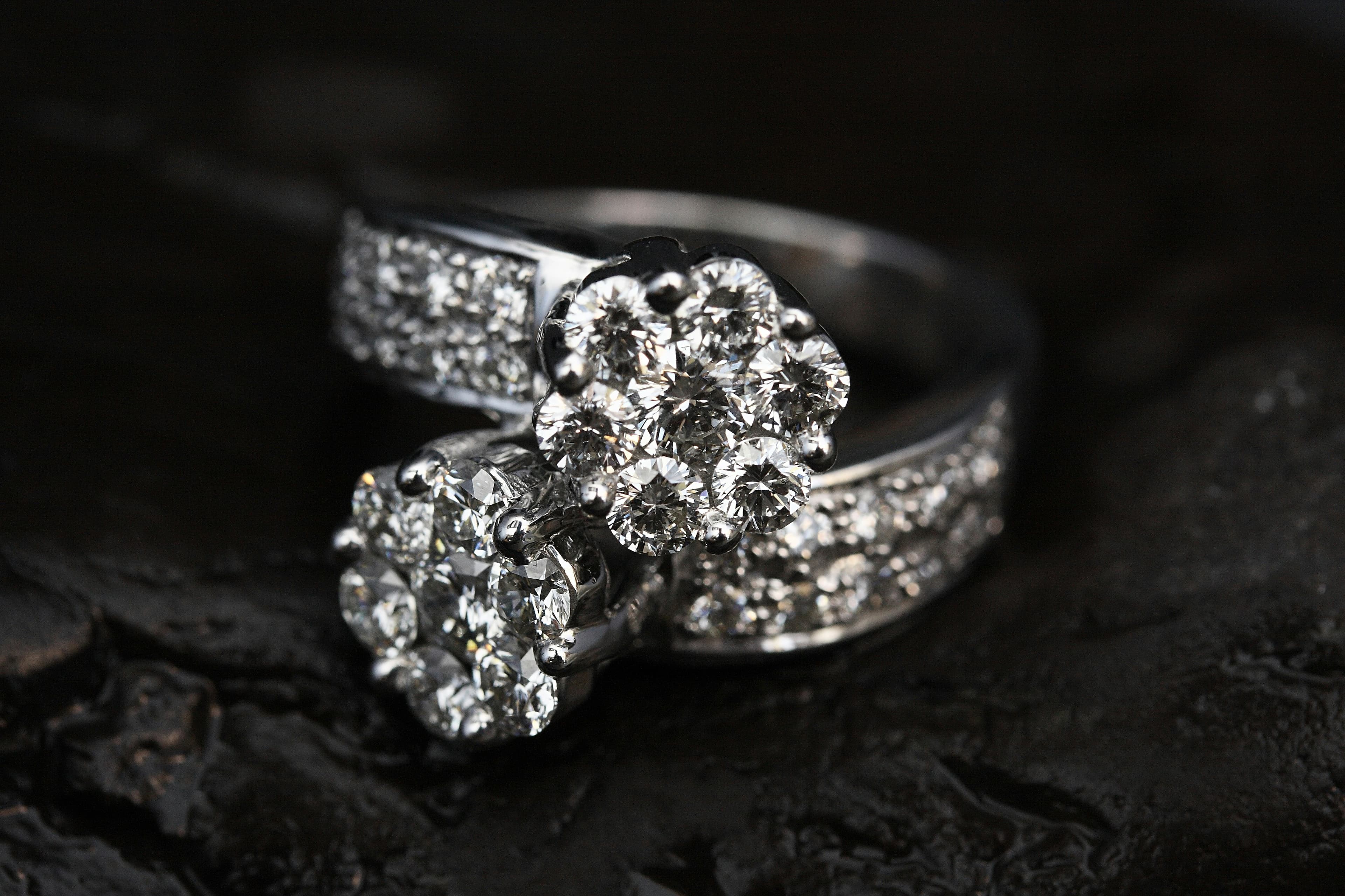Diamond rings arranged on dark polished stone