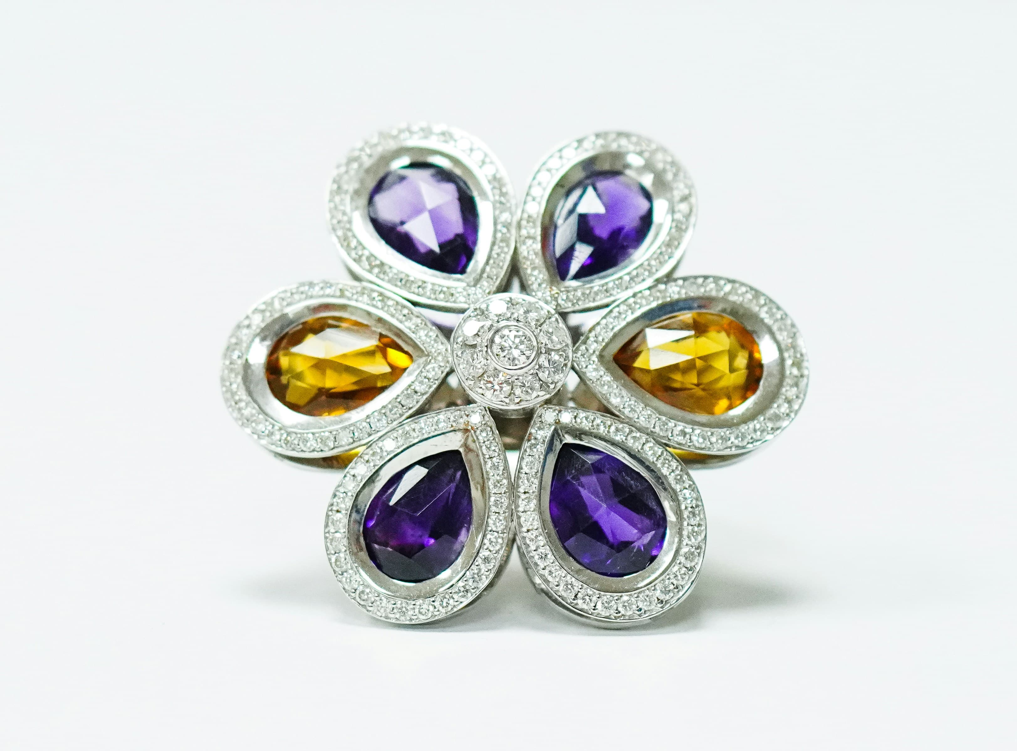 An ornate ring set with coloured stones