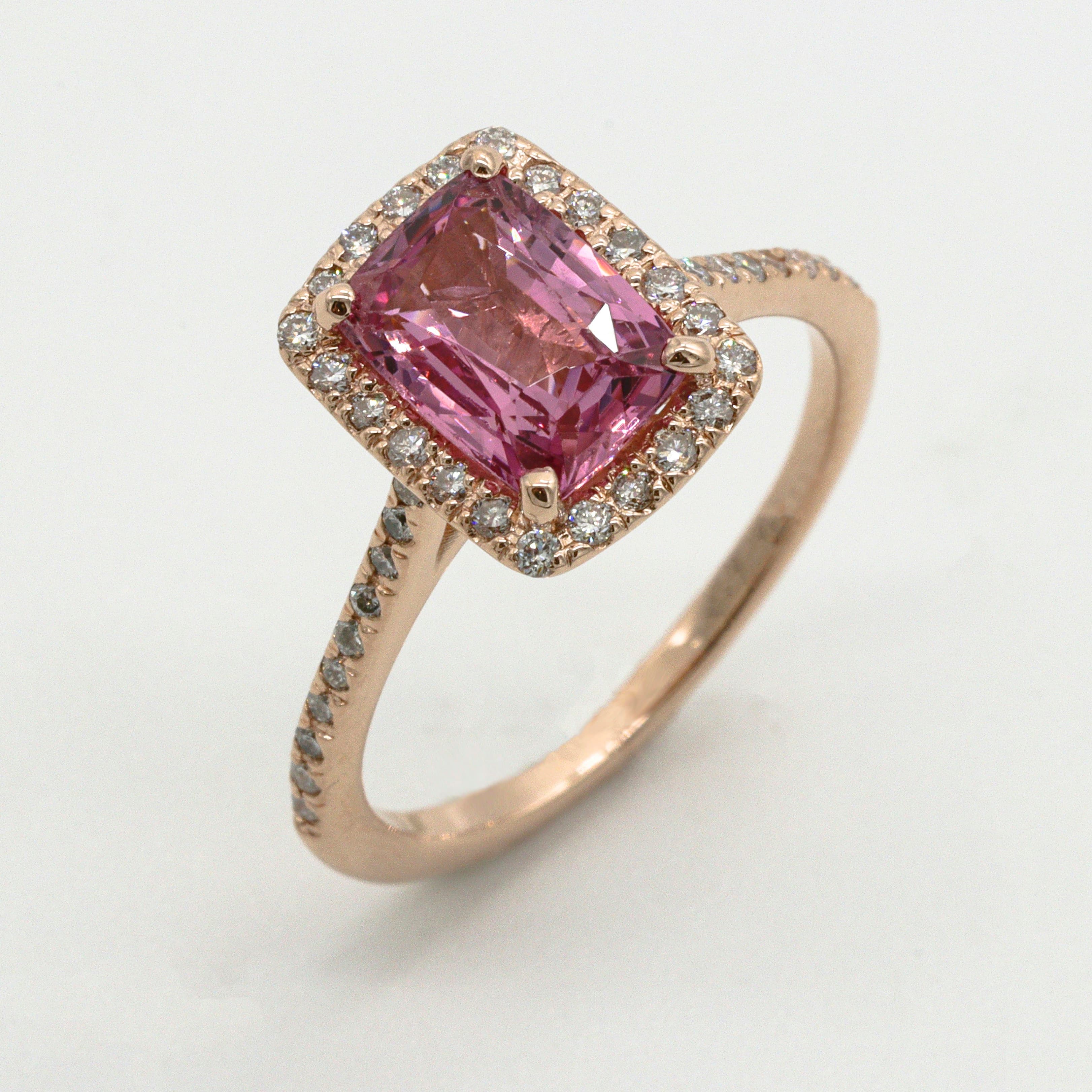 A pink sapphire halo ring