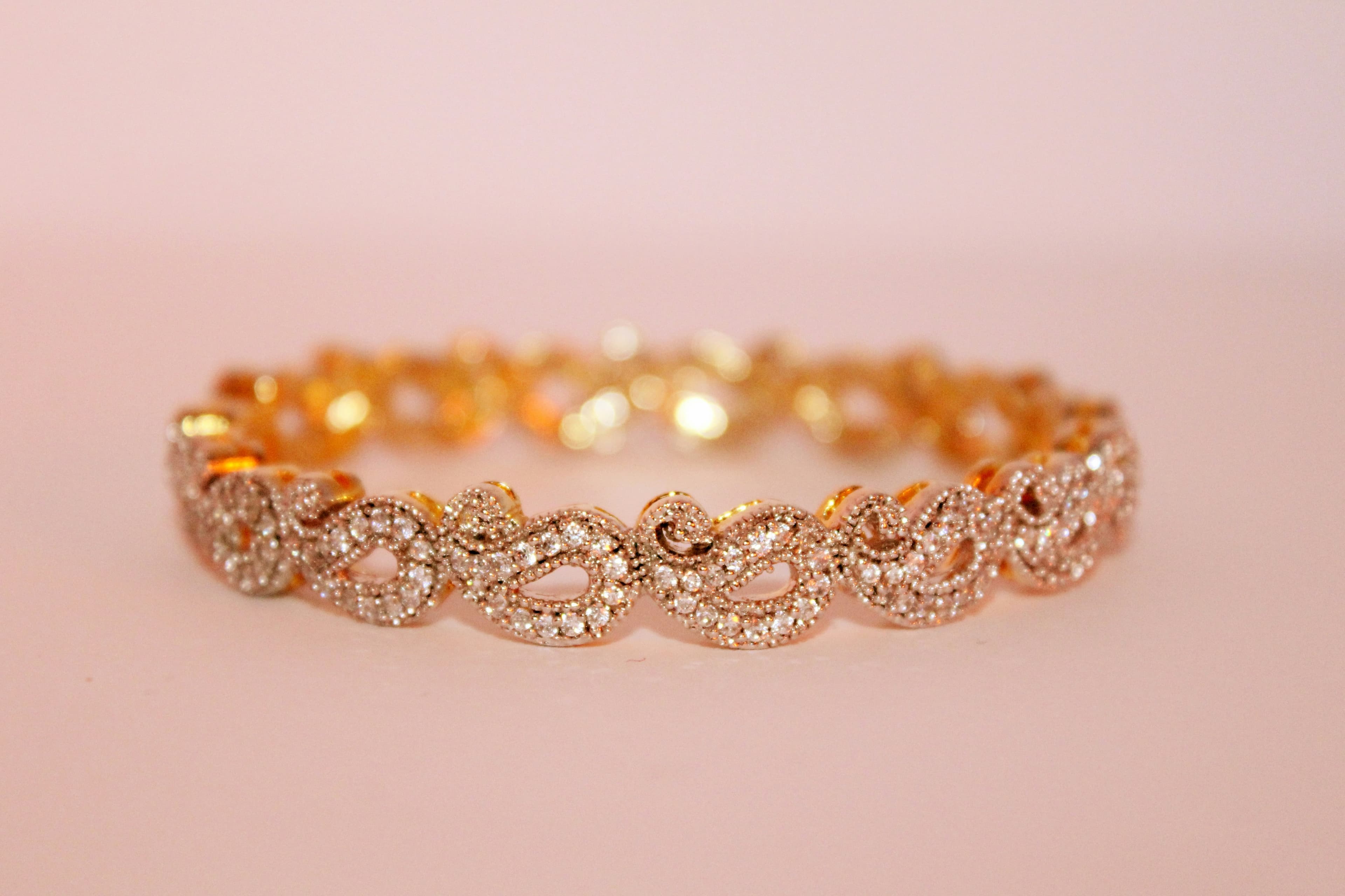 A rose gold bracelet set with small stones